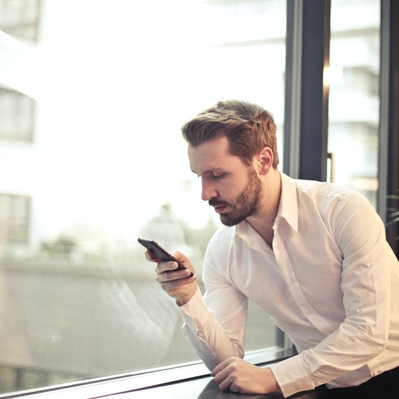 man searching through online business directories